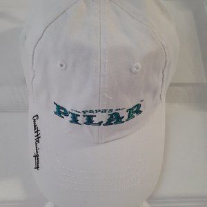White baseball cap ,Papa's Pilar Rum ,Earnest Hemm